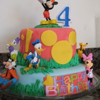 Mickey Mouse Birthday Cake A cake I made for my son's birthday yesterday. Design was inspired by another cake I saw online. Fondant, yellow cake, chocolate cake...