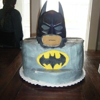 Batman white cake with strawberry fill, cover in whipp cream some fondant fondant used an actual mask for face, this was for my grand sons...