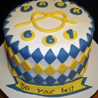 Cub Scout Cake This Cub Scout theme cake was done for my son's Blue & Gold Banquet. The overhand knot was made by extruding fondant through a...