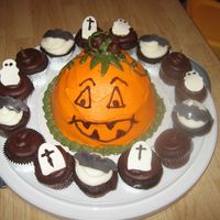 Pumpkin With Scary Cupcakes Pumpkin and frosting on cupcakes - buttercream. Fondant gravestones, bats & ghosts