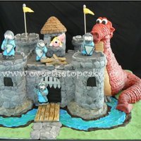 Castle Castle is cake, towers and dragon are rkt. All covered in fondant.