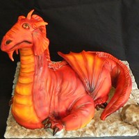 Red Dragon This was made for my friend's son. The head and neck are RKT and the body, arms and tail are cake. All covered in fondant and then...