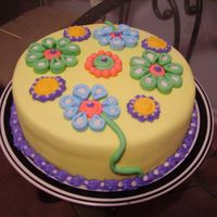 Flower Cake I got this idea from Liis. It was the first cake I did in a while, and just was needing to do a practice cake. Its yellow cake, with butter...