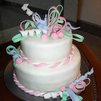 Festive Birthday Cake vanilla cake covered in MMF with gumpaste ribbons TFL!
