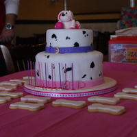 Dalmation Puppy Party These are a stack of 9" and 6" cakes. Hand painted dalmation spots, gumpaste pink puppy with ball on top, and fondant collars...