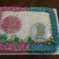 1St Birthday Cake this was a vanilla cake all buttercream made for a boy and a girl twin so i used to differnt colors on each side