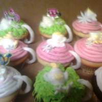 Teacup Cupcakes french vanilla cupcakes with butterream icing and fondant accents for the handle i hand rolled out and little fondant with flowers