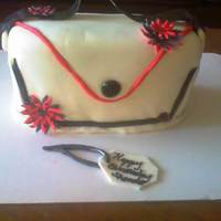 Purse vanallia cake with buttercream and fondant and fondant flowers