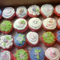 Flower Cupcakes strawberry cupcakes with butter cream icing and fondant flowes