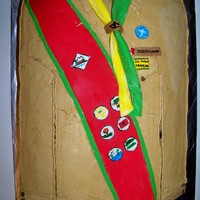 Scout Uniform This 12 x 18 monster has chocolate filling, fondant decorations and looked much better in person. :)