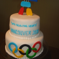 Olympic Cake Top layer - Lemon cake with raspberry filingBottom layer - Yellow cake with chocolate chipsFondant icing