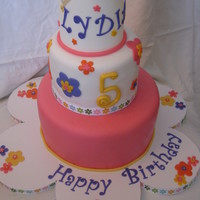 Lydia's Cake Cake was inspired by and coordinated w/ the invitation. 6/9" strawberry WASC. Covered w/ MMF. Gumpaste crown.