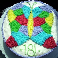 First Wilton Course 1 Cake! Our teacher drew the butterfly and our class all made different, really pretty colors and filled in our pictures!