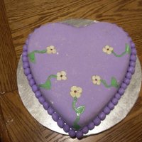 Purple Heart Chocolate cake with butter cream frosting, covered with fondant