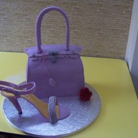 Hermes Berkin Bag madeira cake with ganache filling covered with fondant,the handle and the shoe were made of homemade gumpaste.shoe accent is silver dragees...