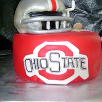 Ohio State 10 inch whit cake with strawberry mousse filling, helmit carved white cake with strawberry mousse filling, both covered wth buttercream...