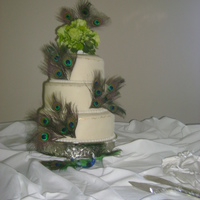 Peacock Wedding Cake 8, 10 & 12 in First and third white almond sour cream cake with raspberry mousse. middle chocolate with chocolate fudge mousse. Covered...