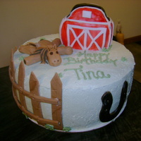 Farm Birthday Cake chocolate cake covered in bc, barn is rk covered in fondant, fence, horseshoe and horse are fondant