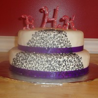 Monogram And Scrolls Fondant covered cake. Buttercream scroll work. Candy melts monogram, freehand, no mold. Satan riboon