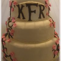 Cherry Blossom Wedding Cake First ever Wedding cake. 3 tier. Top tier- Carrot cake with Cream Cheese filling, Second Tier- White cake with Raspberry filling, bottom-...