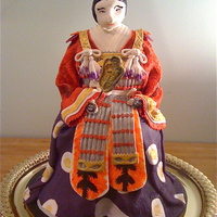 Samurai Samurai, spice cake with vanilla butter cream filling and chocolate fondant overlay. Everything is edible except the skewer for the shield...