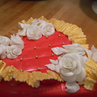 One From The Heart Valentines heart shaped two layer Red Velvet cake with Cream cheese filling and decorative chocolate fondant roses and fondant overlay.