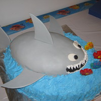 Shark Fondant shark with fish candles on buttercream icing cake. Vegan!