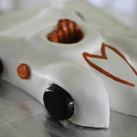 Speed Racer Car Boys Speed Racer bithday.Cherry Chip cake with Vanilla buttercream covered in fondant.