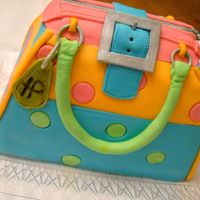 A Teenagers Purse Too late for contest I know! This cake is chocolate pound cake iced in buttercream and covered in fondant. Hardware is gumpaste. Was a lot...