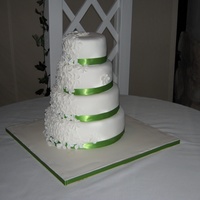 White Fondant With White Fondant Flowers First wedding cake (and first four tier cake). Thanks for all the help from Cake Central friends!