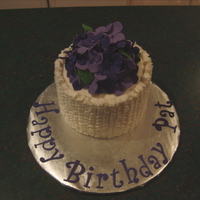 Purple Hydrangeas And Ruffles Gumpaste hydranges on small 5" cake with buttercream ruffles. Used mini ball pan for small ball of cake to mound the hydrangeas on.