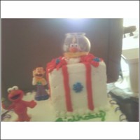 Emlo, Mr. Noodle And Dorothy wasc pineapple filling- bottom box was made from 1 sheet cake cut in 3 and squared off. the present was 1 1/2 layers bc filling