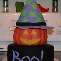 Halloween Pumpkin Cake This is a charity cake for a local shelter for pregnant teens. It was funfetti cake filled with chocolate fudge and a rice krispie treat...