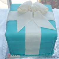 Tiffany Box Cake Pink velvet cake with raspberry filling, raspberry chambord buttercream, and covered in marshmallow fondant.