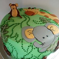 Baby Shower Cake This Almond Joy flavored cake was based on the Mother to Be's Nursery theme - Nojo Bedding in Zoo Friends. The figures are all fondant...