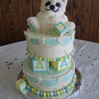 Baby Bear And Blocks Cake is chocolate and vanilla marble. Accents are made of gumpaste and fondant, and cake iced with buttercream and fondant.