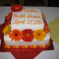 Congratulations Nicole! White cake with chocolate mousse for filling, fondant balls and all buttercream frosting.