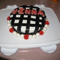 Happy Birthday Jenna! Chocolate cake with buttercream and fondant accents. White chocolate lettering with red sprinkles.