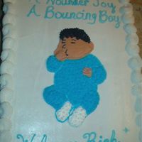 Im000347.jpg This is a cake I did for a baby shower. Baby sucking thumb.