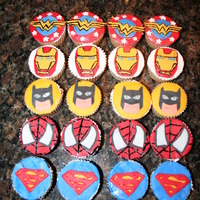 Superheros! Superhero cupcakes decorated with fondant cutouts.