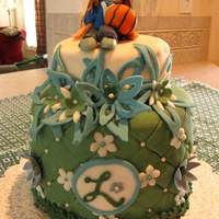 Lauren Cake All fondant and gumpaste cake. This was done for two girls who are graduating. We had a night to honor them at church.