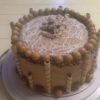 Speciality Cake Butter cake with Creamy Peanut butter center, Pirolines and Peanut butter malt balls. Absolutely wonderful combination