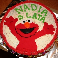 Elmo Fondant Elmo, buttercream icing, Smarties on the sides.