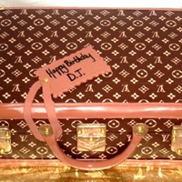 Louis Vuitton Briefcase 2 layer 11X7 sheet covered in fondant and edible images and fondant accents painted with gold highlighter dust.