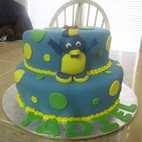 Pablo Backyardigans pablo is handmade with gumpaste, 2 tier, 10" and 8" some round fondant details in yellow and green. For a first birthday