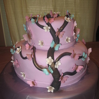 Butterflies Cake !!! Bottom cake is a 10" with a 6" inch on top. Marshmellow fondant in a soft lavander color with hand made butterflies big and small...