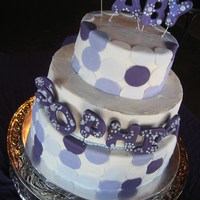 Contemporary Baby Shower Cake Tiered contemporary baby shower cake with purple polka-dots.