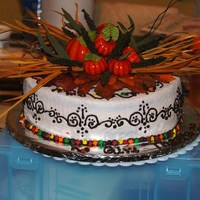Thanksgiving Cake This is my first Thanksgiving cake. I made the topper myself, and that was a first also. This is a spice cake with buttercream frosting.