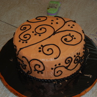 Scroll Work? This is a pina colada cake, torted with pineapple filling. It was my first time torting... and this is my first attempt at scroll work.......