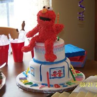 Elmo's World It's Elmo's World!! My son's first birthday cake. I made Elmo out of RK treats and modeling chocolate, and I hand painted...